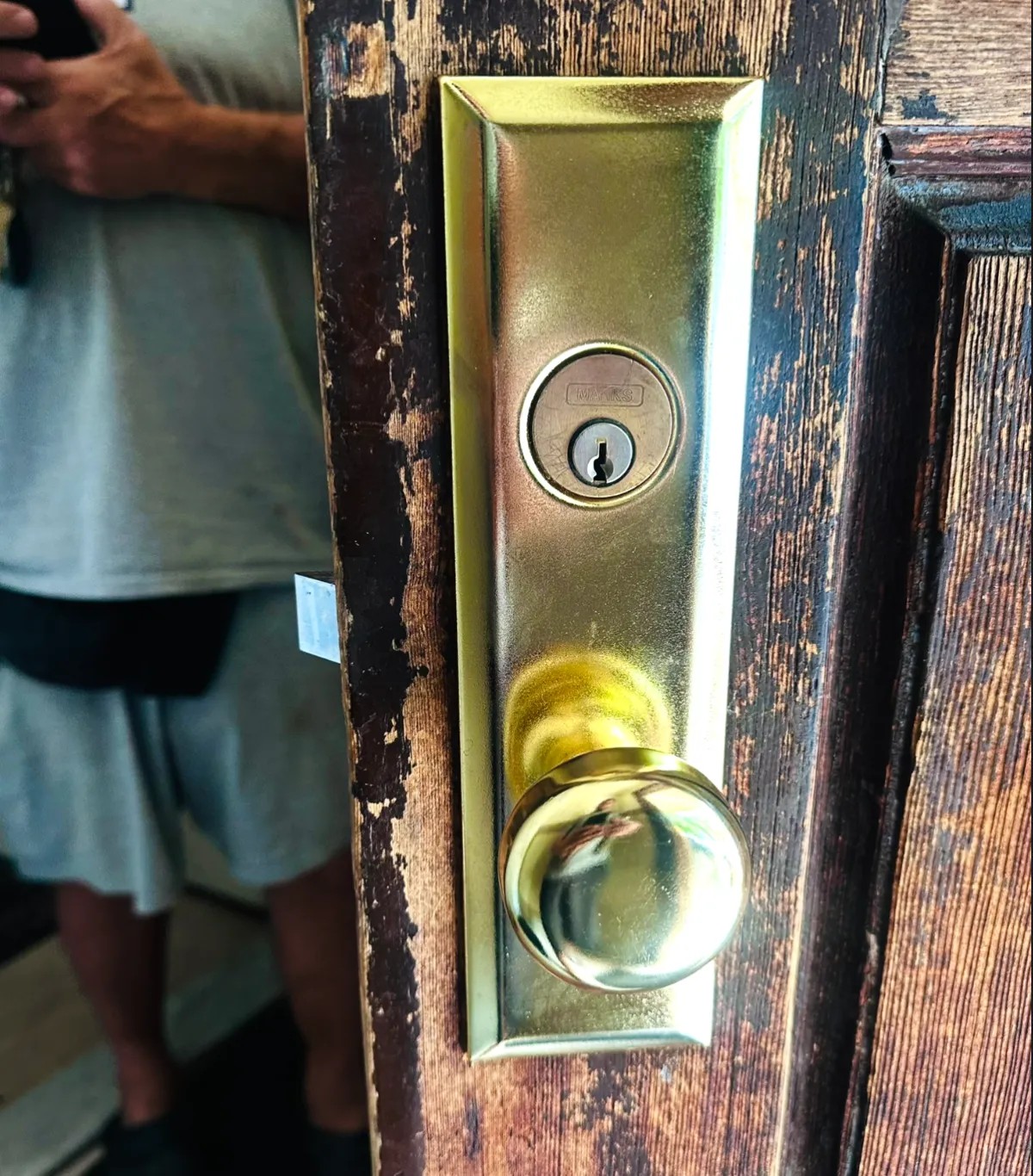 Polished brass Marks mortise lock installed on a vintage Brooklyn brownstone front door